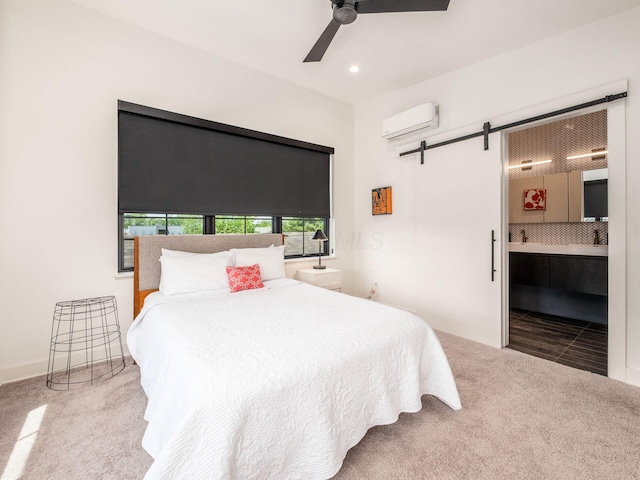 460 S Lane Unit 460, Columbus, OH 43206 - carpeted bedroom with a wall unit AC, a barn door, recessed lighting, connected bathroom, and ceiling fan