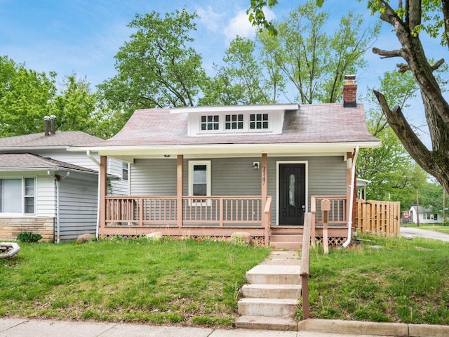 3147 Grasmere Ave, Columbus, OH 43224 - bungalow featuring a porch and a chimney
