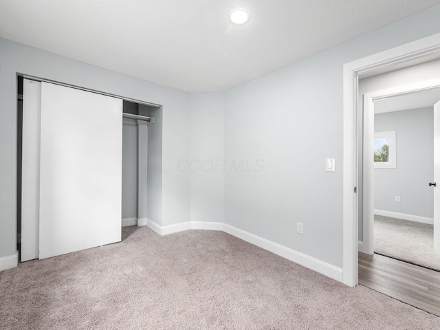 3147 Grasmere Ave, Columbus, OH 43224 - unfurnished bedroom featuring baseboards, a closet, recessed lighting, and carpet
