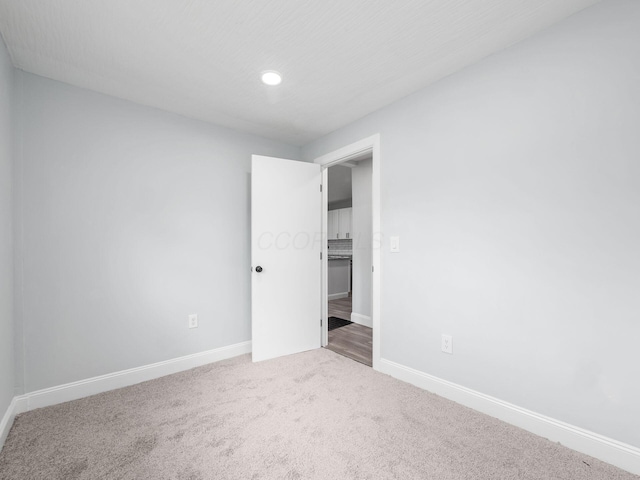 3147 Grasmere Ave, Columbus, OH 43224 - unfurnished bedroom featuring baseboards, recessed lighting, and carpet floors