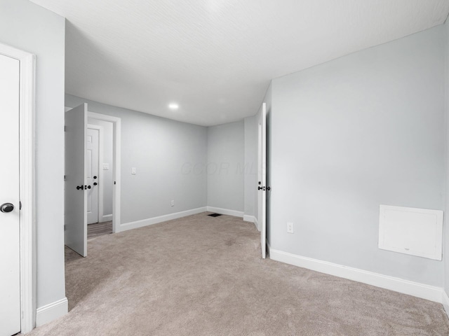 3147 Grasmere Ave, Columbus, OH 43224 - below grade area with light carpet, baseboards, and visible vents