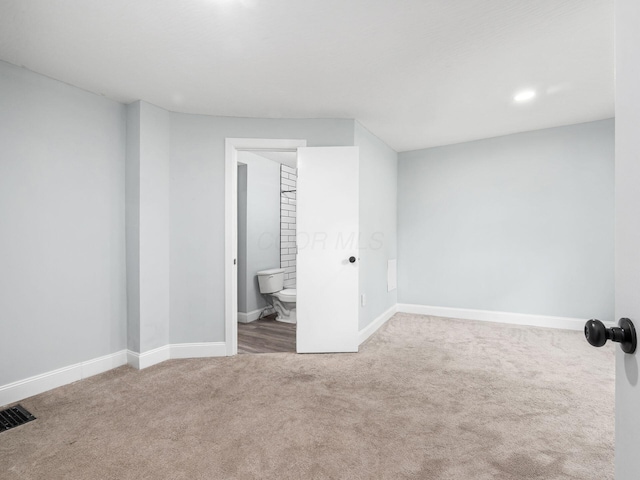 3147 Grasmere Ave, Columbus, OH 43224 - unfurnished bedroom featuring connected bathroom, carpet floors, visible vents, baseboards, and recessed lighting