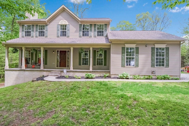 12094 Beech Tree Ct S, Thornville, OH 43076 - view of front of property with a front lawn, a chimney, and a porch
