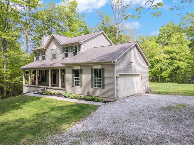 12094 Beech Tree Ct S, Thornville, OH 43076 - view of front of home with a porch, a chimney, a garage, a front lawn, and driveway