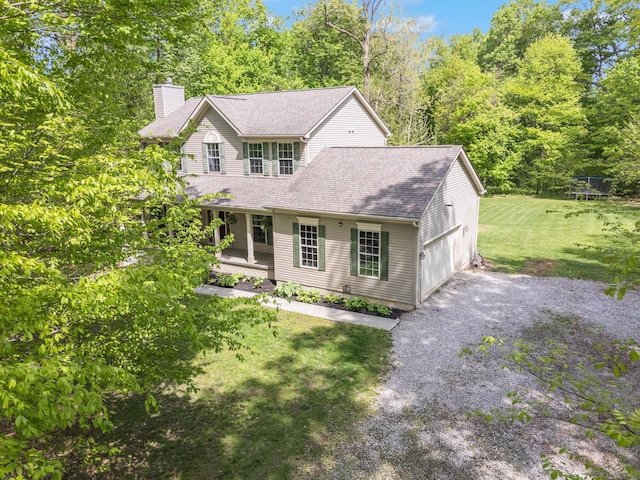 12094 Beech Tree Ct S, Thornville, OH 43076 - view of front facade featuring a chimney, covered porch, a front yard, an attached garage, and driveway