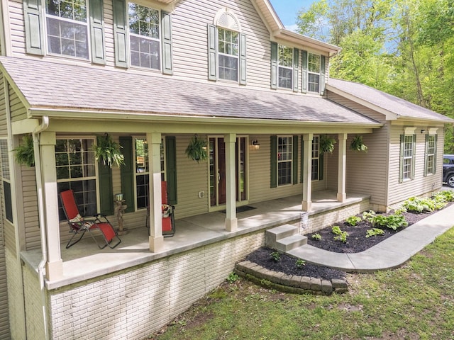 12094 Beech Tree Ct S, Thornville, OH 43076 - back of house with covered porch and a shingled roof