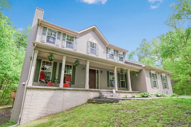 12094 Beech Tree Ct S, Thornville, OH 43076 - view of front of house featuring a porch, a chimney, and a front yard