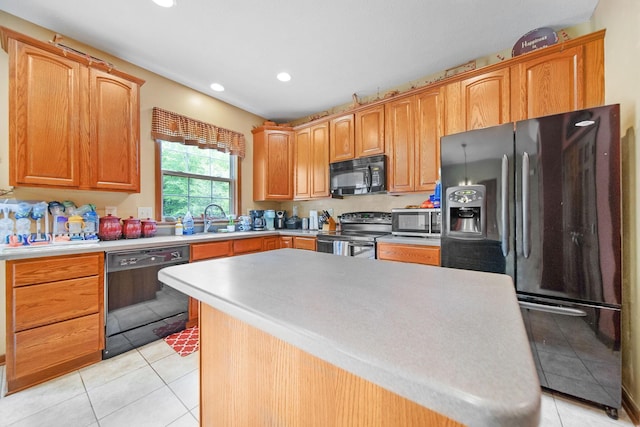 12094 Beech Tree Ct S, Thornville, OH 43076 - kitchen with black appliances, light tile patterned flooring, light countertops, a sink, and recessed lighting