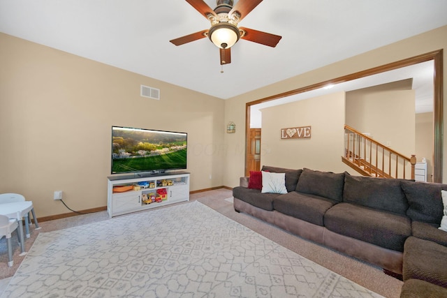 12094 Beech Tree Ct S, Thornville, OH 43076 - living area with light carpet, baseboards, a ceiling fan, stairs, and vaulted ceiling