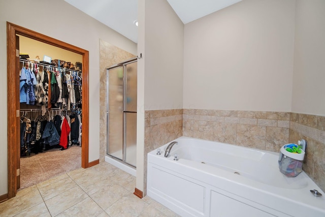 12094 Beech Tree Ct S, Thornville, OH 43076 - full bathroom featuring a walk in closet, a stall shower, a garden tub, and tile patterned floors