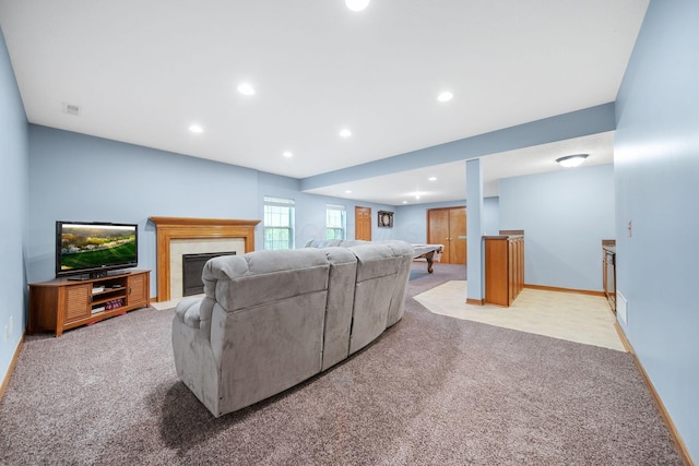 12094 Beech Tree Ct S, Thornville, OH 43076 - living area featuring light carpet, recessed lighting, a fireplace with flush hearth, and baseboards