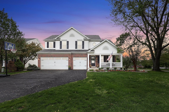 4215 Mack Ct, Powell, OH 43065 - view of front of home featuring driveway, an attached garage, a porch, a front yard, and roof with shingles