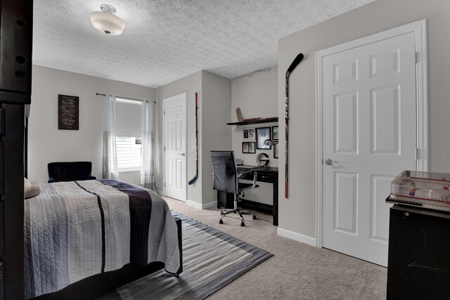 4215 Mack Ct, Powell, OH 43065 - bedroom with carpet flooring, an office area, a textured ceiling, and baseboards