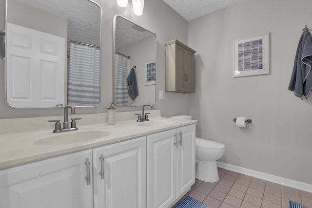 4215 Mack Ct, Powell, OH 43065 - full bath with a textured ceiling, tile patterned flooring, toilet, baseboards, and double vanity