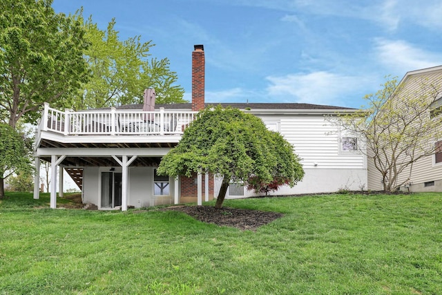 4215 Mack Ct, Powell, OH 43065 - rear view of property featuring a wooden deck, a yard, and a chimney