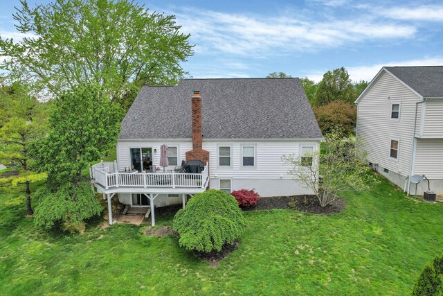 4215 Mack Ct, Powell, OH 43065 - rear view of property featuring a deck, a yard, a chimney, and roof with shingles