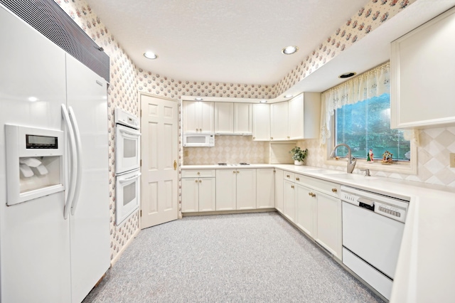 685 Dogwood Ln, Newark, OH 43055 - kitchen featuring white appliances, a sink, light countertops, backsplash, and recessed lighting