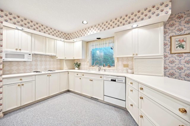 685 Dogwood Ln, Newark, OH 43055 - kitchen with white appliances, a sink, wallpapered walls, tasteful backsplash, and light countertops