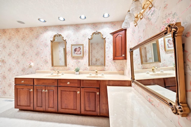 685 Dogwood Ln, Newark, OH 43055 - bathroom with wallpapered walls, double vanity, and recessed lighting