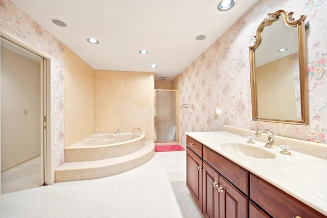 685 Dogwood Ln, Newark, OH 43055 - bathroom with a stall shower, vanity, recessed lighting, a garden tub, and wallpapered walls