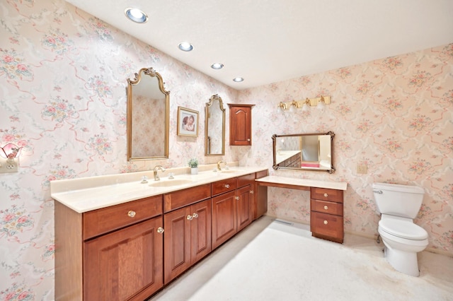 685 Dogwood Ln, Newark, OH 43055 - bathroom featuring toilet, double vanity, recessed lighting, and baseboards