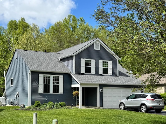 view of front of house with roof with shingles and a front yard