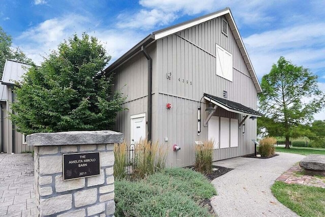1211 Darcann Dr, Columbus, OH 43220 - view of property exterior with board and batten siding