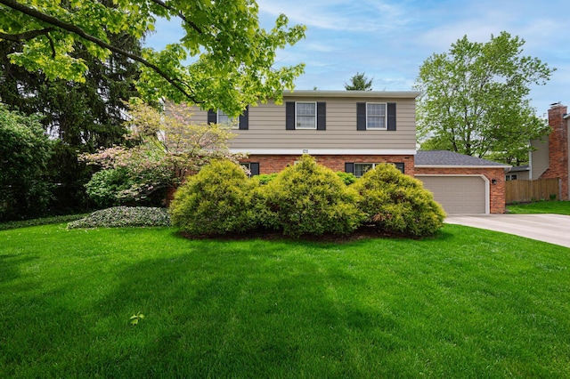 1211 Darcann Dr, Columbus, OH 43220 - view of front of home with brick siding, driveway, and an attached garage