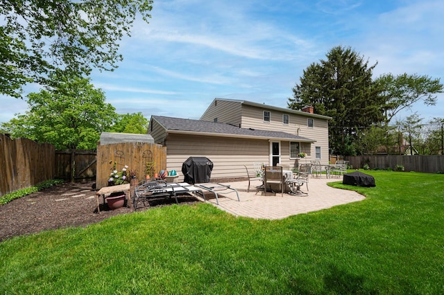 1211 Darcann Dr, Columbus, OH 43220 - rear view of house featuring a patio and a chimney