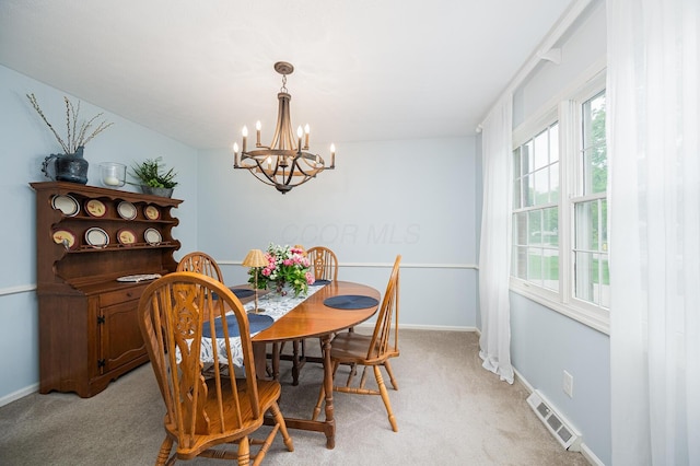 1211 Darcann Dr, Columbus, OH 43220 - dining room featuring a chandelier, light colored carpet, and baseboards