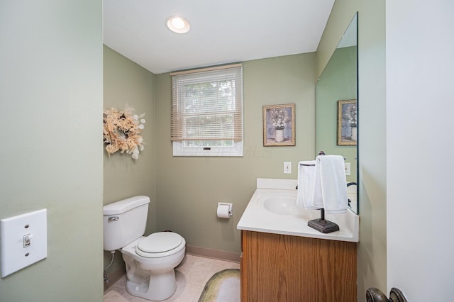 1211 Darcann Dr, Columbus, OH 43220 - bathroom with toilet, baseboards, vanity, and tile patterned floors