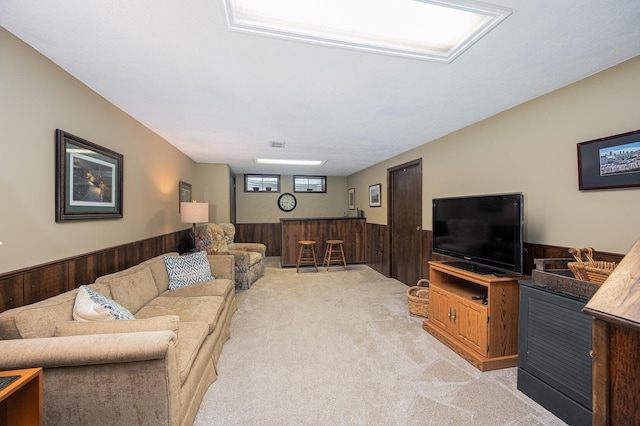 1211 Darcann Dr, Columbus, OH 43220 - living area with wainscoting, a dry bar, light colored carpet, and wooden walls