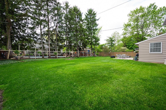 1211 Darcann Dr, Columbus, OH 43220 - view of yard featuring a patio