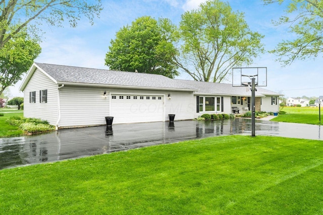 2040 Riggs Rd, Newark, OH 43055 - view of front of house with an attached garage, a front lawn, and asphalt driveway
