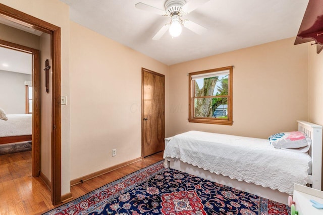 2040 Riggs Rd, Newark, OH 43055 - bedroom featuring wood finished floors, baseboards, and ceiling fan