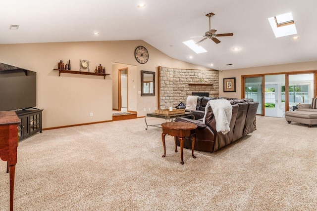 2040 Riggs Rd, Newark, OH 43055 - carpeted living area with a skylight, ceiling fan, lofted ceiling, a fireplace, and baseboards