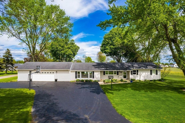 2040 Riggs Rd, Newark, OH 43055 - single story home featuring an attached garage, asphalt driveway, and a front lawn