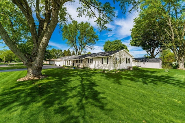 2040 Riggs Rd, Newark, OH 43055 - view of front of property with a front lawn, an attached garage, and asphalt driveway