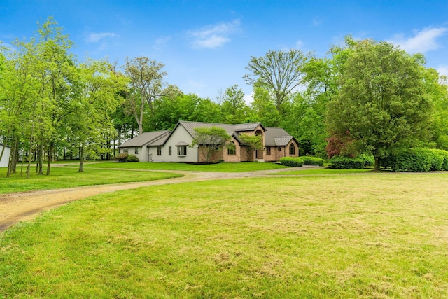 3100 Kropp Rd, Grove City, OH 43123 - view of front of house with dirt driveway, a front lawn, and view of wooded area