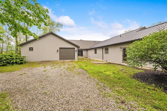 3100 Kropp Rd, Grove City, OH 43123 - rear view of property featuring metal roof, a standing seam roof, and gravel driveway