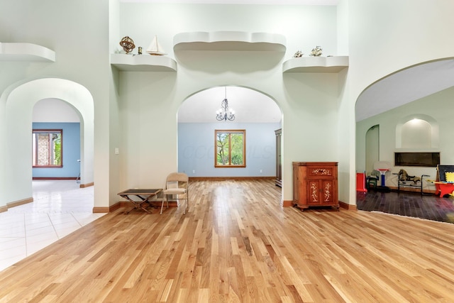 3100 Kropp Rd, Grove City, OH 43123 - living area with a high ceiling, arched walkways, and wood finished floors