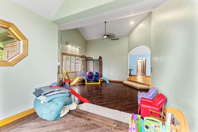 3100 Kropp Rd, Grove City, OH 43123 - recreation room featuring wood finished floors, high vaulted ceiling, ceiling fan, baseboards, and arched walkways