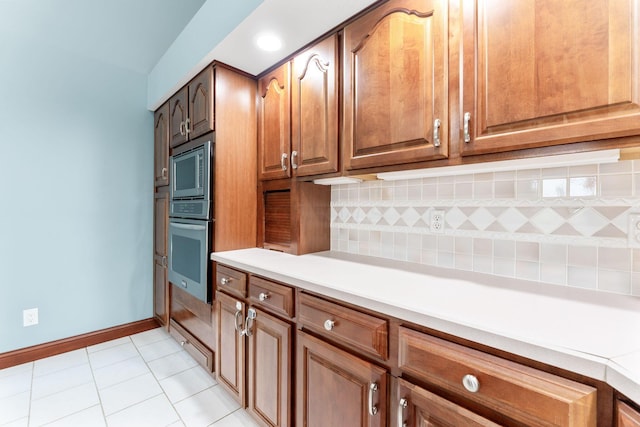 3100 Kropp Rd, Grove City, OH 43123 - kitchen featuring stainless steel appliances, backsplash, light tile patterned flooring, light countertops, and baseboards