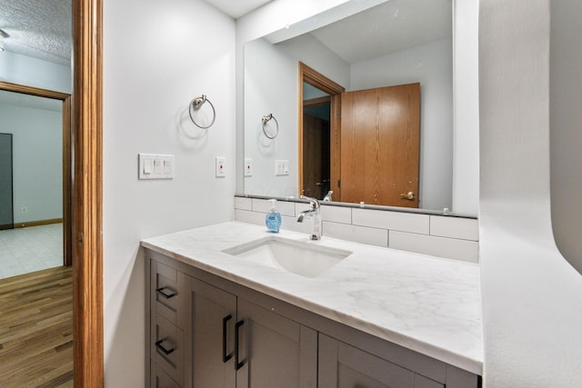 3100 Kropp Rd, Grove City, OH 43123 - bathroom featuring vanity, wood finished floors, and baseboards