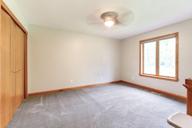 3100 Kropp Rd, Grove City, OH 43123 - unfurnished bedroom with carpet floors, baseboards, a closet, and ceiling fan