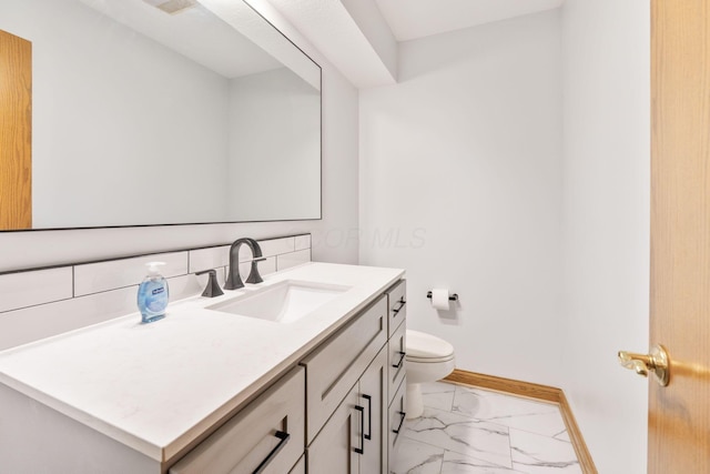 3100 Kropp Rd, Grove City, OH 43123 - bathroom featuring marble look tiles, baseboards, toilet, and vanity