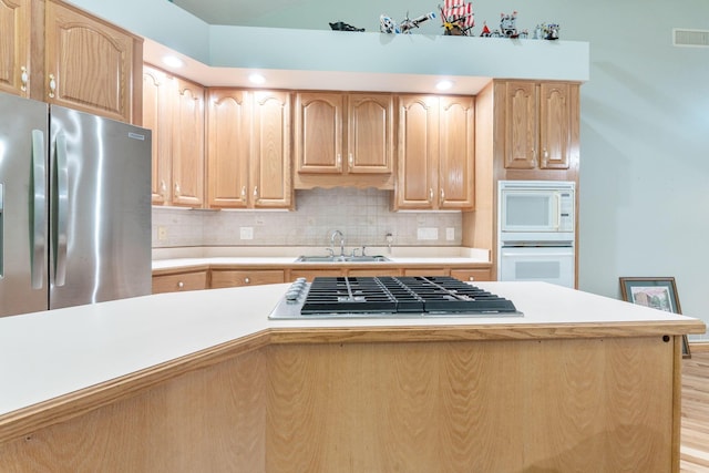 3100 Kropp Rd, Grove City, OH 43123 - kitchen with appliances with stainless steel finishes, light brown cabinetry, a sink, light countertops, and backsplash