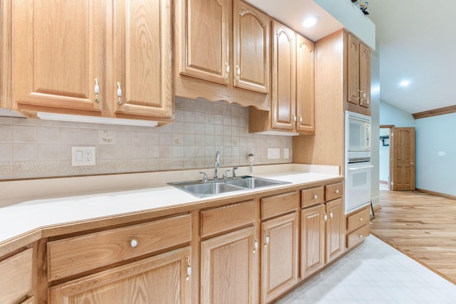 3100 Kropp Rd, Grove City, OH 43123 - kitchen featuring a sink, light countertops, decorative backsplash, light brown cabinetry, and lofted ceiling