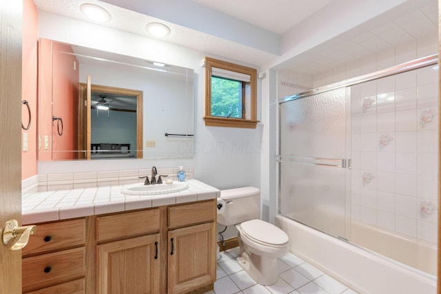 3100 Kropp Rd, Grove City, OH 43123 - bathroom with toilet, vanity, tile patterned floors, bath / shower combo with glass door, and ceiling fan