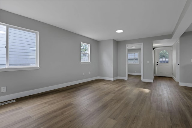 193 Seymour Ave, Buckeye Lake, OH 43008 - unfurnished bedroom featuring baseboards, multiple windows, dark wood finished floors, and recessed lighting